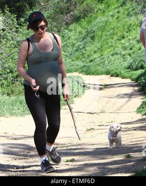 Heavily pregnant Milla Jovovich and her husband Paul go for a walk with their pet dogs in Beverly Hills  Featuring: Milla Jovovich Where: Beverly Hills, California, United States When: 13 Mar 2015 Credit: WENN.com Stock Photo
