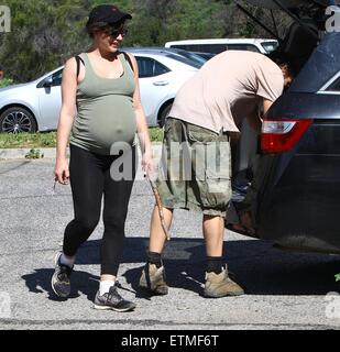 Heavily pregnant Milla Jovovich and her husband Paul go for a walk with their pet dogs in Beverly Hills  Featuring: Milla Jovovich, Paul W.S. Anderson Where: Beverly Hills, California, United States When: 13 Mar 2015 Credit: WENN.com Stock Photo