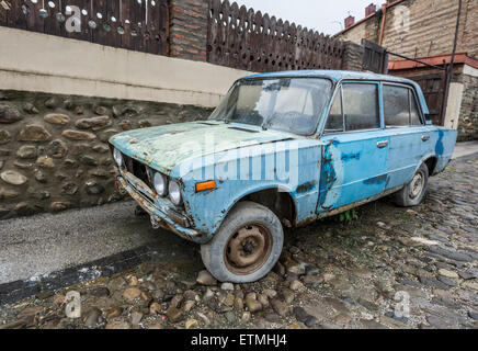 Old rusty VAZ 2106 (Lada 1600) car in small town Sighnaghi in Kakheti region of Georgia Stock Photo