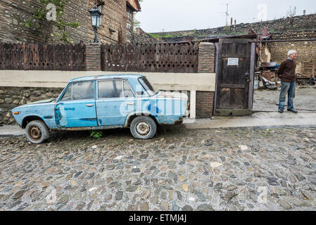 Old rusty VAZ 2106 (Lada 1600) car in small town Sighnaghi in Kakheti region of Georgia Stock Photo