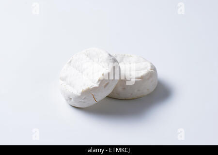 two wheels of soft creamy cheese with white mold Stock Photo