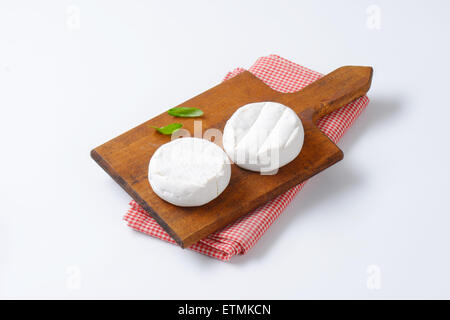 two wheels of soft creamy cheese with white mold Stock Photo