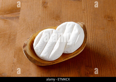 two wheels of soft creamy cheese with white mold Stock Photo