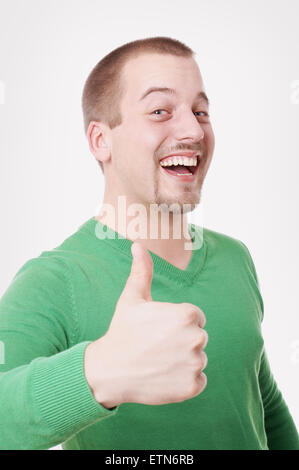 young man giving thumbs up Stock Photo