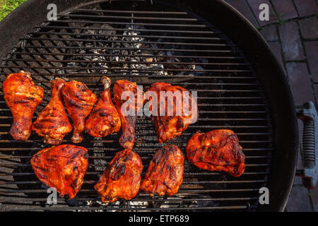 Chicken legs smoked barbecue cooked on charcoal grill Stock Photo