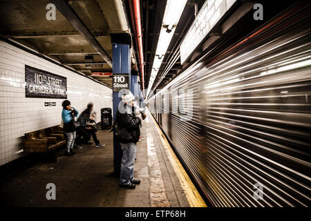 Commuters waiting on platform on the NYC Subway Stock Photo