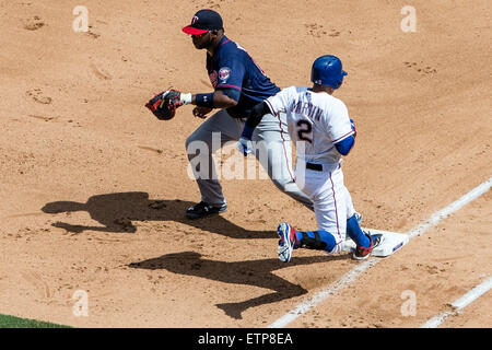 Arlington, TX, USA. 13th June, 2015. Texas Rangers center fielder Leonys Martin (2) is forced out at first base on a close play by Minnesota Twins designated hitter Kennys Vargas (19) during the the Major League Baseball game between the Minnesota Twins and the Texas Rangers at Globe Life Park in Arlington, TX. Tim Warner/CSM/Alamy Live News Stock Photo