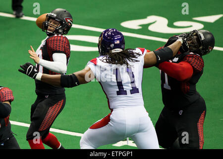 New Orleans, LA, USA. 12th June, 2015. New Orleans VooDoo dl Kwame Jordan (11) makes his way to Cleveland Gladiators qb Shane Austin (10) during the game between the Cleveland Gladiators and New Orleans VooDoo at Smoothie King Center in New Orleans, LA. Stephen Lew/CSM/Alamy Live News Stock Photo