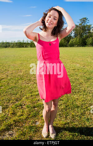 Young female poses playfully to the camera Stock Photo
