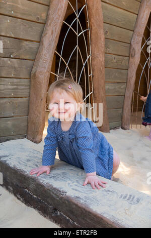 Child / children / baby enjoy activities sand / sand pit / sandpit. Hobbledown urban farm / theme park / childrens farm Epsom UK Stock Photo