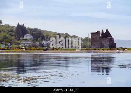 View across sea Loch Ranza to castle ruins in village of Lochranza Isle of Arran North Ayrshire Strathclyde Scotland UK Britain Stock Photo