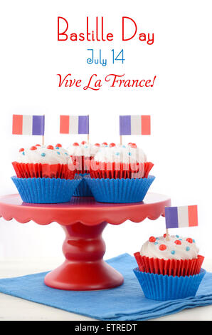 Red, white and blue theme cupcakes on white wood table for Bastille Day or French party celebration. Stock Photo