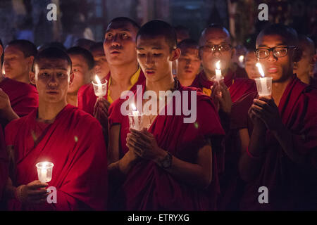 June 12, 2015 - Kathmandu, Nepal - Buddhist monks taking part in a mass gathering and candlelight vigil held at Boudhanath Stupa on 49th day after the April 25 earthquake in Kathmandu, Nepal. The massive earthquake which struck Nepal on April 25 and ensuing aftershocks have left nearly 9,000 people dead and destroyed or damaged tens of thousands of houses in Nepal. (Credit Image: © Sumit Shrestha/ZUMA Wire/ZUMAPRESS.com) Stock Photo