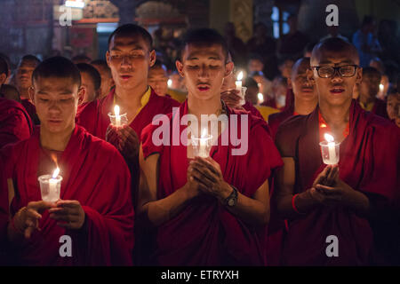 June 12, 2015 - Kathmandu, Nepal - Buddhist monks taking part in a mass gathering and candlelight vigil held at Boudhanath Stupa on 49th day after the April 25 earthquake in Kathmandu, Nepal. The massive earthquake which struck Nepal on April 25 and ensuing aftershocks have left nearly 9,000 people dead and destroyed or damaged tens of thousands of houses in Nepal. (Credit Image: © Sumit Shrestha/ZUMA Wire/ZUMAPRESS.com) Stock Photo