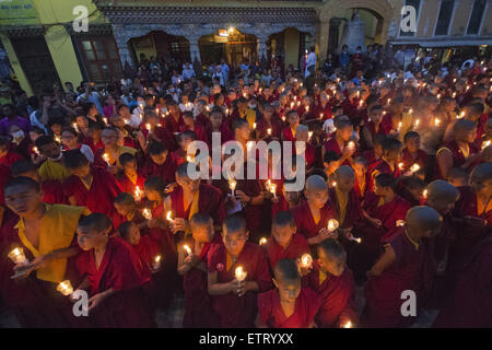 June 12, 2015 - Kathmandu, Nepal - Buddhist monks taking part in a mass gathering and candlelight vigil held at Boudhanath Stupa on 49th day after the April 25 earthquake in Kathmandu, Nepal. The massive earthquake which struck Nepal on April 25 and ensuing aftershocks have left nearly 9,000 people dead and destroyed or damaged tens of thousands of houses in Nepal. (Credit Image: © Sumit Shrestha/ZUMA Wire/ZUMAPRESS.com) Stock Photo