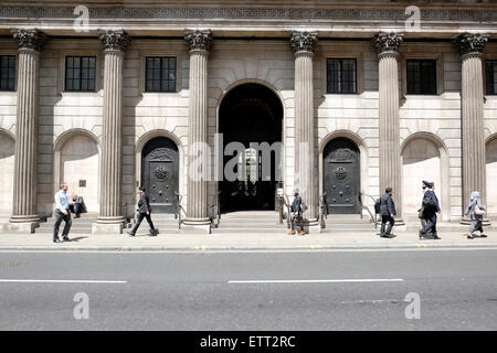 People walk past the bank of England Stock Photo