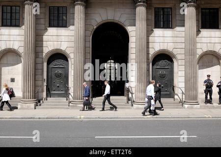 People walk past the bank of England Stock Photo