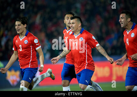 Santiago, Chile. 15th June, 2015. Players of Chile celebrate a goal against Mexico during the the Group A match of the Copa America 2015, at the National Stadium, in Santiago, Chile, on June 15, 2015. The match ended with a 3-3 draw. Credit:  Pedro Mera/Xinhua/Alamy Live News Stock Photo