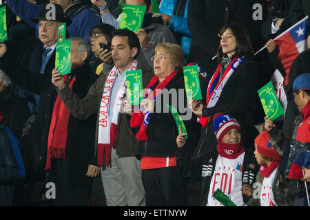 Santiago, Chile. 15th June, 2015. President of Chile Michelle Bachelet (C) attends the Group A match between Chile and Mexico at the Copa America 2015, at the National Stadium, in Santiago, Chile, on June 15, 2015. Credit:  Pedro Mera/Xinhua/Alamy Live News Stock Photo