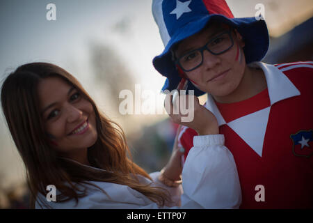 Santiago, Chile. 15th June, 2015. Fans of Chile pose prior to the Group A match of the Copa America 2015 between Chile and Mexico, to be held at the National Stadium, in Santiago, Chile, on June 15, 2015. Credit:  Pedro Mera/Xinhua/Alamy Live News Stock Photo