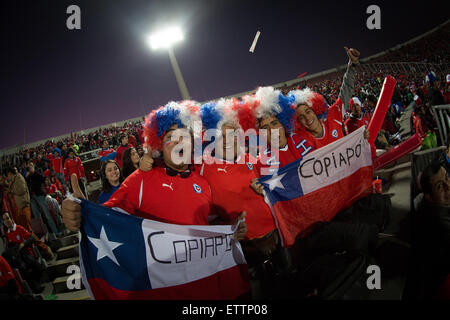 Santiago, Chile. 15th June, 2015. Fans of Chile react prior to the Group A match of the Copa America 2015 between Chile and Mexico, to be held at the National Stadium, in Santiago, Chile, on June 15, 2015. Credit:  Pedro Mera/Xinhua/Alamy Live News Stock Photo