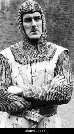 John Cleese filming the British comedy film 'Monty Python and the Holy Grail' at the old castle of Dounne in Scotland. The crew dressed as medieval knights during shooting of the film which is based on King Arthur and his knights of the Round Table. 8th M Stock Photo