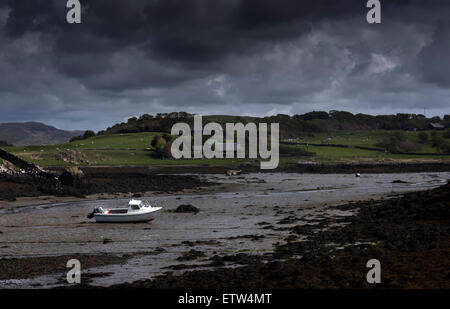 single boat moored at low tide at Croig Loch a' Chumbainn Isle of Mull Inner Hebrides Argyll Scotland Stock Photo