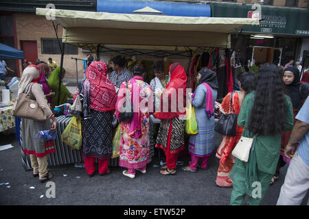 Women shop for clothes at a Bangladeshi street fair and festival in ...
