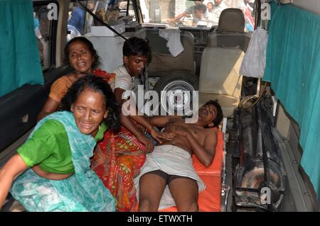 Allahabad, India. 16th June, 2015. An injured Indian is being carried to the hospital after the Jaguar fighter aircraft of the Indian Air Force crashed this morning at Chaka in Naini near Allahabad in Uttar Pradesh. Both the pilots managed to eject safely. The plane which had taken off at 7:25 am from the Bamrauli air strip in Allahabad was on a routine training sortie. The pilots reportedly sent signals to the ground staff that there was some major technical glitch with the aircraft. Credit:  PACIFIC PRESS/Alamy Live News Stock Photo