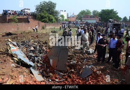 Allahabad, India. 16th June, 2015. Airforce officers along with local police inspecting after a Jaguar fighter aircraft of the Indian Air Force crashed this morning at Chaka in Naini near Allahabad in Uttar Pradesh. Both the pilots managed to eject safely. The plane which had taken off at 7:25 am from the Bamrauli air strip in Allahabad was on a routine training sortie. The pilots reportedly sent signals to the ground staff that there was some major technical glitch with the aircraft. Credit:  PACIFIC PRESS/Alamy Live News Stock Photo