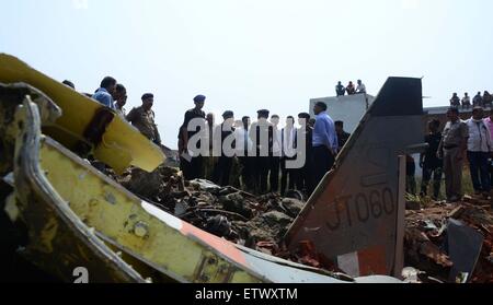 Allahabad, India. 16th June, 2015. Airforce officials along with local police inspecting after the Jaguar fighter aircraft of the Indian Air Force crashed this morning at Chaka in Naini near Allahabad in Uttar Pradesh. Both the pilots managed to eject safely. The plane which had taken off at 7:25 am from the Bamrauli air strip in Allahabad was on a routine training sortie. The pilots reportedly sent signals to the ground staff that there was some major technical glitch with the aircraft. Credit:  PACIFIC PRESS/Alamy Live News Stock Photo