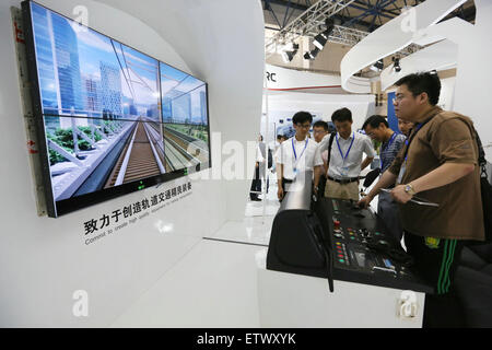 Beijing, China. 16th June, 2015. Visitors experience simulation driving during the UrTran 2015 International Urban Rail Exhibition in Beijing, capital of China, June 16, 2015. The three-day UrTran 2015 exhibition kicked off at China International Exhibition Center in Beijing Tuesday. Credit:  Xinhua/Alamy Live News Stock Photo