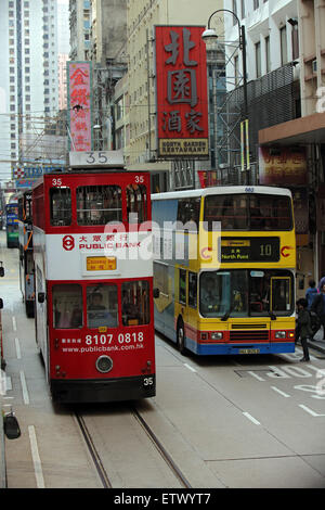 Hong Kong, China, bus and tram in a street Stock Photo