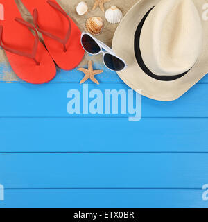 Beach scene in summer on vacation with shells, hat, sandals, copyspace Stock Photo