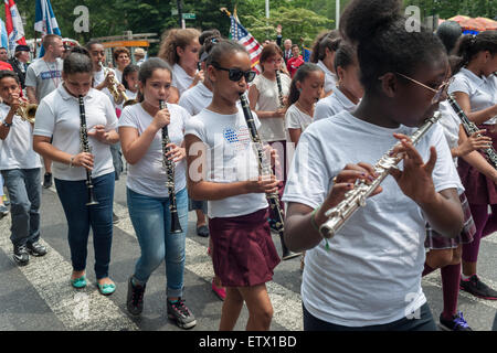 A marching band from PS 192 in New York plays in the annual Flag Day Parade on Friday, June 12, 2015, starting at New York City Hall Park. While the holiday is on June 14 the parade was held on the previous Friday to accommodate the schools involved. Flag Day, was created by proclamation by President Woodrow Wilson on June 14, 1916 as a holiday honoring America's flag but it was not until 1949 when it became National Flag Day.  The holiday honors the 1777 Flag Resolution where the stars and stripes were officially adopted as the flag of the United States. (© Richard B. Levine) Stock Photo