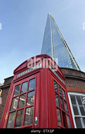The Shard with traditional red phone booth in foreground Stock Photo