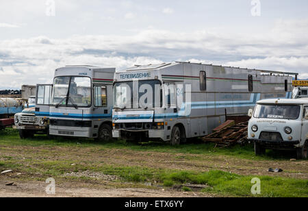 Old ZIL-133, two Kamaz Ajokki Magnolia 83A serie 1 and 2 mobile TV stations and UAZ 452 in Georgia Stock Photo