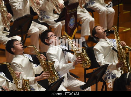 Beijing, China. 16th June, 2015. Bandsmen of a student wind band from Beijing No. 2 Experimental Primary School perform at the National Center for the Performing Arts in Beijing, capital of China, June 16, 2015. The school band concert is held here Tuesday. Credit:  Wu Xiaoling/Xinhua/Alamy Live News Stock Photo