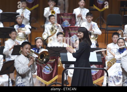 Beijing, China. 16th June, 2015. Bandsmen of a student wind band from Beijing No. 2 Experimental Primary School perform at the National Center for the Performing Arts in Beijing, capital of China, June 16, 2015. The school band concert is held here Tuesday. Credit:  Wu Xiaoling/Xinhua/Alamy Live News Stock Photo