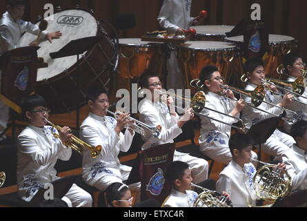 Beijing, China. 16th June, 2015. Bandsmen of a student wind band from Beijing No. 2 Experimental Primary School perform at the National Center for the Performing Arts in Beijing, capital of China, June 16, 2015. The school band concert is held here Tuesday. Credit:  Wu Xiaoling/Xinhua/Alamy Live News Stock Photo