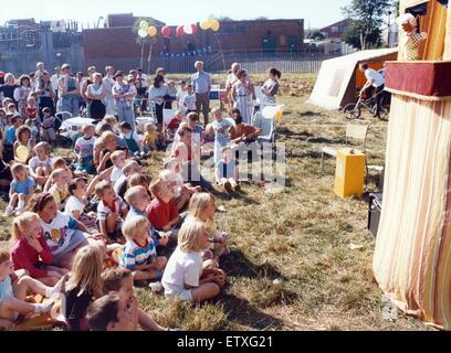 Youngsters are entertained by a Punch and Judy show at Carlin How carnival. 7th September 1991. Stock Photo