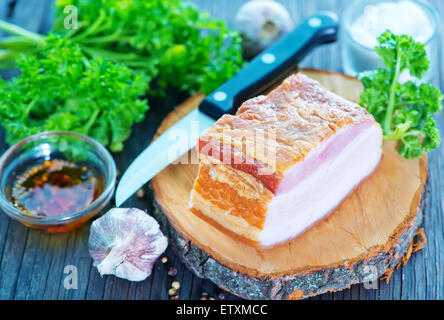 smoked lard with spice on the wooden board Stock Photo