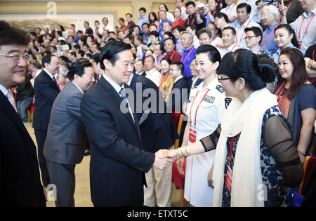 Beijing, China. 16th June, 2015. Liu Qibao (C), a member of the Political Bureau of the Communist Party of China (CPC) Central Committee and head of the CPC Central Committee's Publicity Department, meets with representatives before the national congress of the Chinese Musicians Association in Beijing, capital of China, June 16, 2015. Credit:  Zhang Duo/Xinhua/Alamy Live News Stock Photo