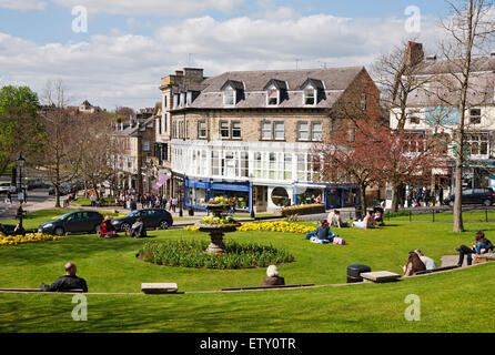 People visitors relaxing sat sitting outside in public garden in spring Montpellier Hill Harrogate North Yorkshire England UK United Kingdom Britain Stock Photo