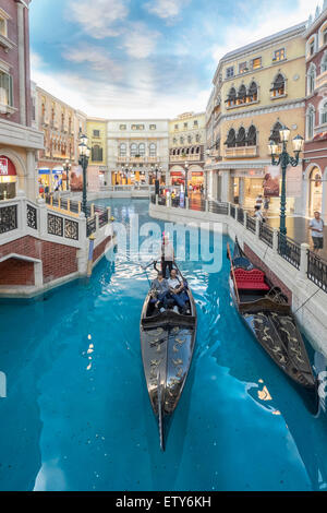 Canal and Gondola on canal inside The Venetian Macao  casino and hotel in Macau China Stock Photo