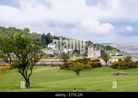 View across golf course to village and castle ruins in Lochranza, Isle of Arran North Ayrshire Western Isles Scotland UK Britain Stock Photo