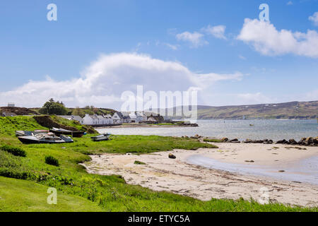 Boats and old cottages beside harbour in Leodamais Bay. Port Ellen Isle of Islay Argyll & Bute Inner Hebrides Scotland UK Stock Photo
