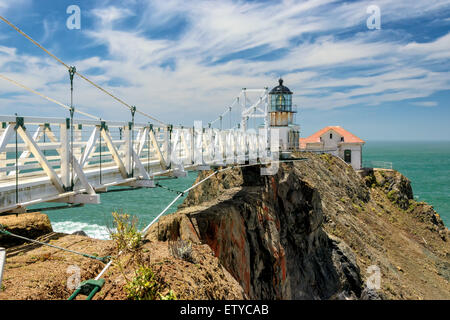 The bridge to Point Bonita Lighthouse on the rock, under beautiful sky, San Francisco, California Stock Photo