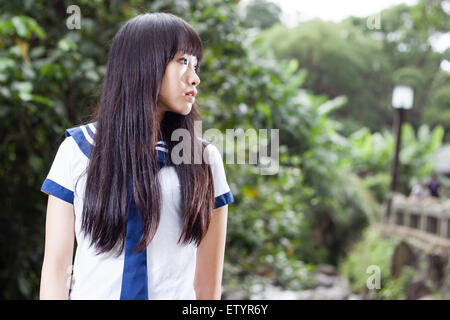 Pretty Chinese high school girl outside Stock Photo