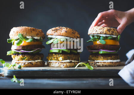 Spiced Zucchini, Feta and Chickpea Veggie Burgers with Minted Yogurt Sauce Stock Photo